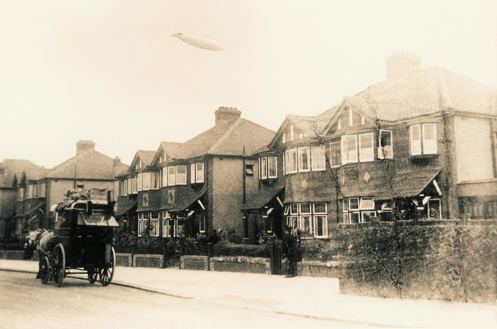 Image from an old postcard showing the English R101 airship over Burnley Road, London c. June 1930 (image from Wikimedia Commons)