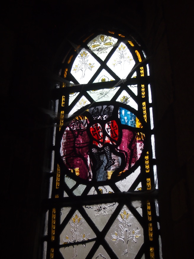 This window depicts two knights riding the same horse, one of the symbols of the Knights Templar